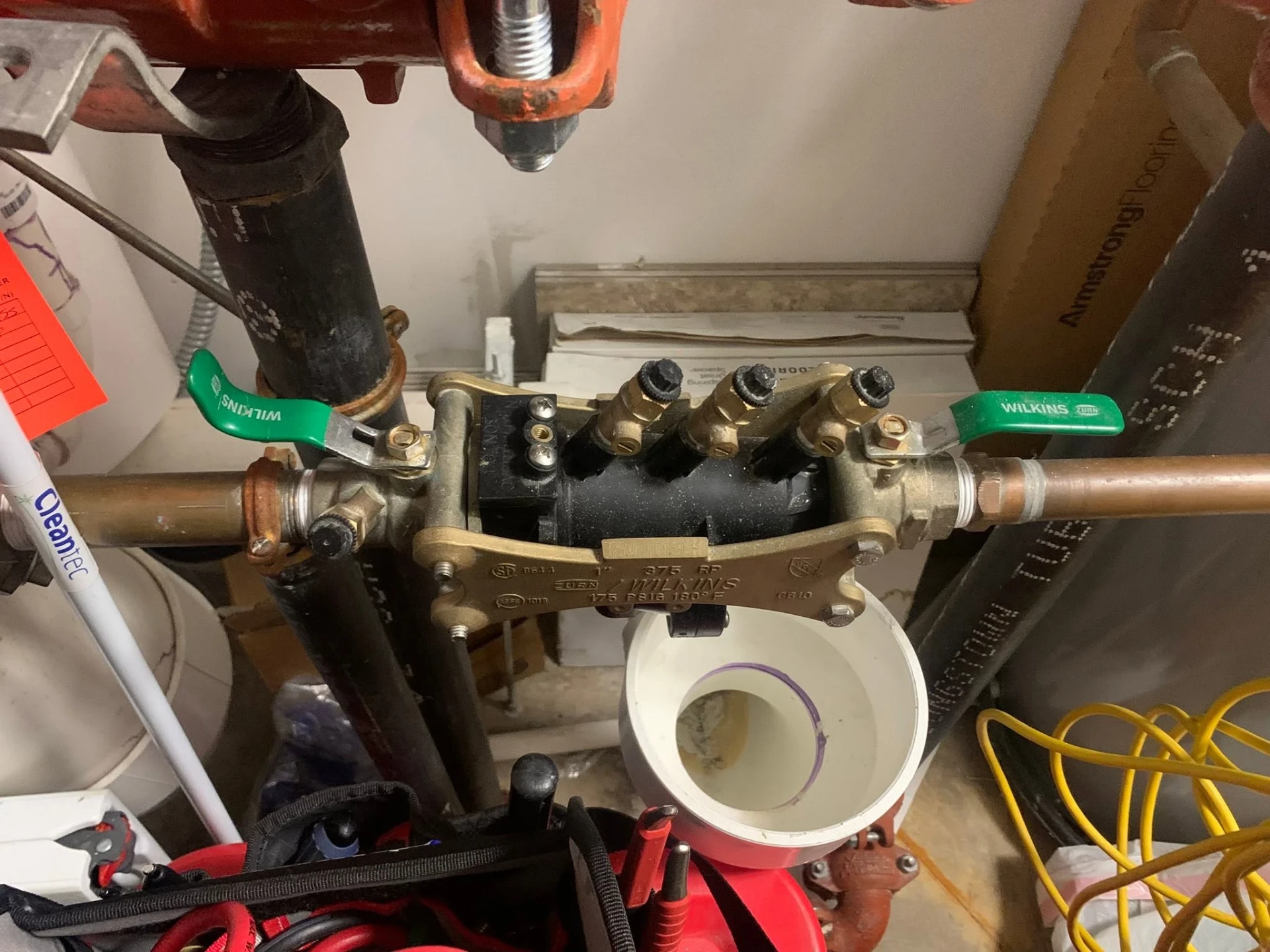 Zurn Wilkins reduced pressure backflow assembly installed on copper pipe with a PVC air gap in a Rochester New York home